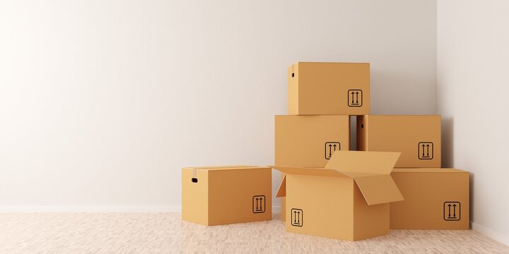 Brown moving storage cardboard boxes closed and open stacked in empty room in apartment or house with wooden floor with copy space