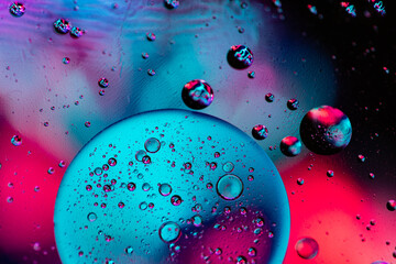 Color oil drop abstract background, Flat images with blurred and sharpen circles together with multicolor background. Stiring water and oil for dynamic holographic effect