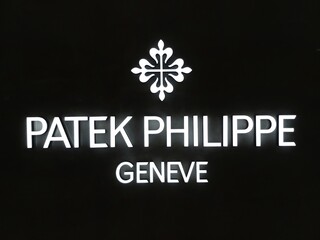 merry christmas sign. 4 january 2021, Bangsar south, Kuala lumpur, Malaysia. The logo of Patek philippe geneve brand with black background.