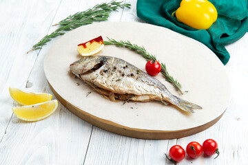 Fototapeta na wymiar Cooked dorado fish in a plate.