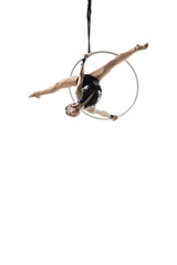 Speed. Young female acrobat, circus athlete isolated on white studio background. Training perfect balanced in flight, rhythmic gymnastics artist practicing with equipment. Grace in performance.