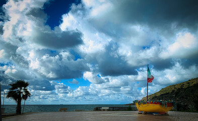 Fototapeta premium Small boat with flag of italy.