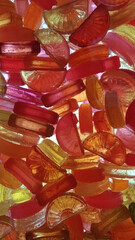 Colored sweet candy in bulk against light
