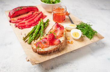Gravlax sourdough sandwich with asparagus and salmon caviar