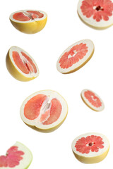 Fresh exotic pomelo fruits falling on white background