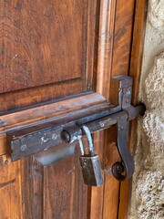 Metal Door Bolt On Antique Wooden Door, Locked and Latched Into Outer Wall