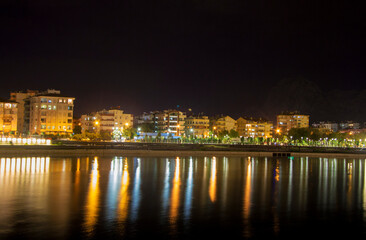Fototapeta na wymiar Nght river in Antalya Konyalti and the town line at night time