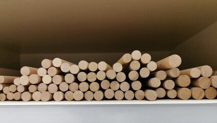 Obraz na płótnie Canvas processed round wood stick in stock