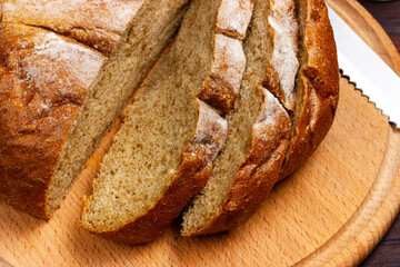 Sliced bread lies on a cutting board.