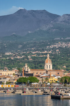 The marina of Riposto town with Etna volcano at background in Sicily