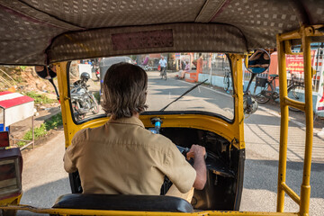 View from the inside of an auto rickshaw in Kerala state, India - obrazy, fototapety, plakaty