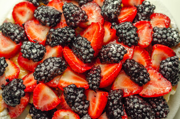 Butter enriched shortcrust pastry topped strawberries and blackberries, seasonal cake with colorful...