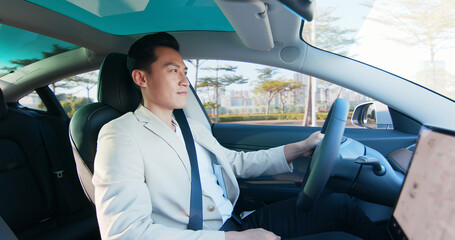 Asian Man Driving Car
