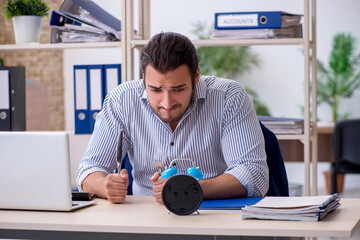 Hungry male employee waiting for food in time management concept