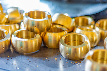 Bronze products, after being made on the machine, lie on the rack.