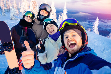 Group of friends with snowboard and ski on winter holidays having fun on snow