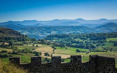 The view on the Velay hills, the Meygal and Mezenc mountains ranges from the dungeon of the fortress of Polignac (Auvergne, France)