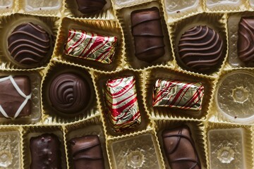 Box with tasty chocolate candies . Assorted gourmet chocolate in a box.