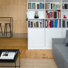 White bookcase and wooden floor