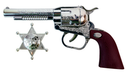 Toy plastic pistol and deputy sheriff badge. Isolated.