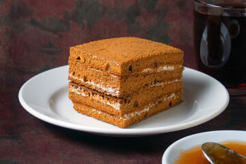 honey cake lies on a white plate