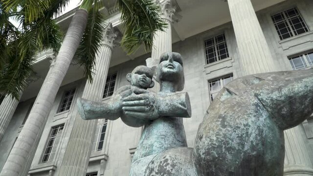 The Iconic Mother And Child Sculpture In Front Of The National Gallery Of Singapore - Low-Angle Shot (Forward)