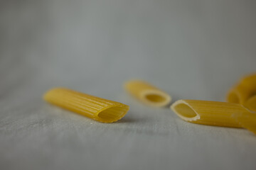 Penne Rigate Pasta Gluten free. gray background