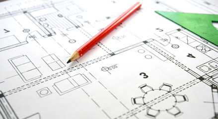 A close-up of a house plan, floor plan, house design with a living room. Drawing a home floor plan, design project using a pencil and a ruler.