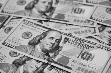 The United States dollars, US currency, one hundred dollar bills, money black and white background...