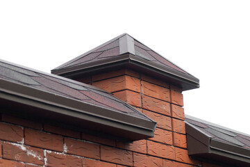 Construction of a brick fence. Installation of ebb, hoods or parapets