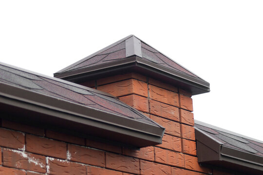 Construction of a brick fence. Installation of ebb, hoods or parapets