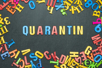 Quarantine, word made from bright color letters on black background