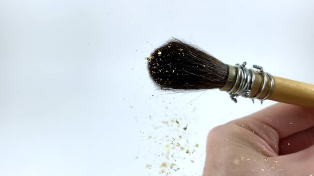 Artisan working on kintsugi process. Slow motion cinematic Kintsukuroi video. Real gold truck gold flakes