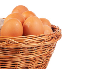 Hen natural eggs in wooden basket isolated on the white