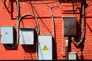 Urban industrial landscape with red brick wall and wires