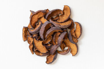 Slices of sun dried fruits dehydrated apples on white background.