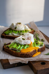 Two sandwiches with avocado and egg for breakfast