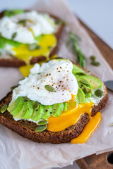 Two sandwiches with avocado and egg for breakfast