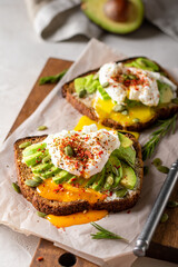 Two sandwiches with avocado and egg for breakfast