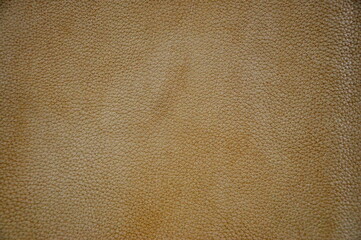 Close up of natural brown leather background. Design of leather upholstery of furniture.