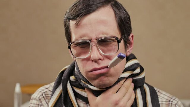 Man in scarf and thermometer