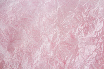 Crumpled paper texture. Valentine's day pink background. Abstract background. Copy space.