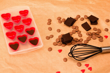Handmade valentines day dessert. DIY Making chocolate candy, heart shaped mold. Chocolatier sweet shop business concept