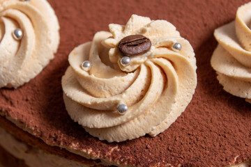 caramel toffee cake with cocoa and coffee beans