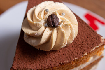 caramel toffee cake with cocoa and coffee beans