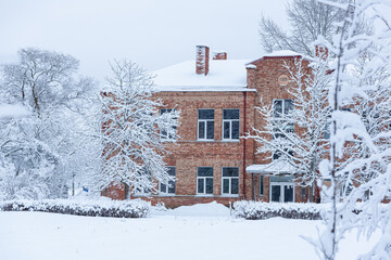 snowy winter on the streets of a small town in january 2021