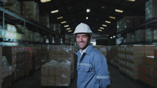 portrait of male caucasian professional enginner wearing uniform hardhat standing and smile with confident and cheerful in warehouse factory