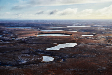 Aerial view over the landscapes of Taimyr. Tundra from above. image of the landscape of the Taimyr Peninsula, Putorana plateau. Norilsk, Russia