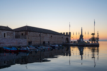 Scenic sunset at Lazise sul Garda, Garda lake, Italy. Garda lake is a popular touristic destination in northern Italy and offers some scenic sunset throughout the year