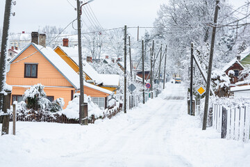 snowy winter on the streets of a small town in january 2021